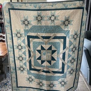 Elegant Blue and Cream Quilt